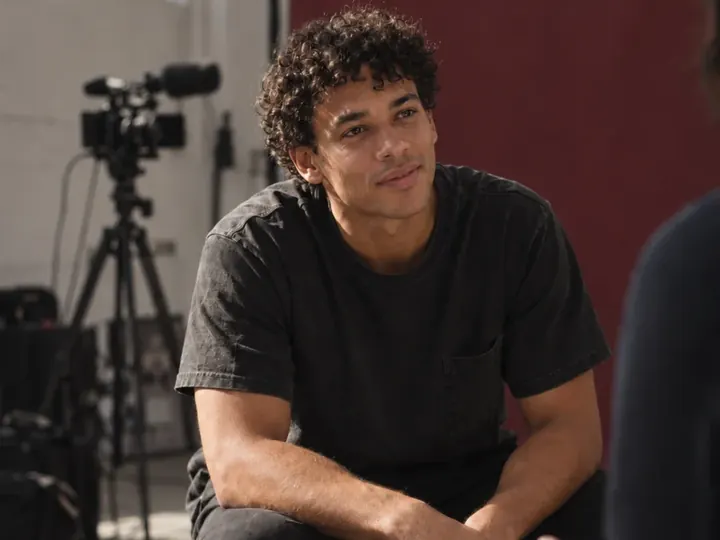 A man being interviewed on a film set.