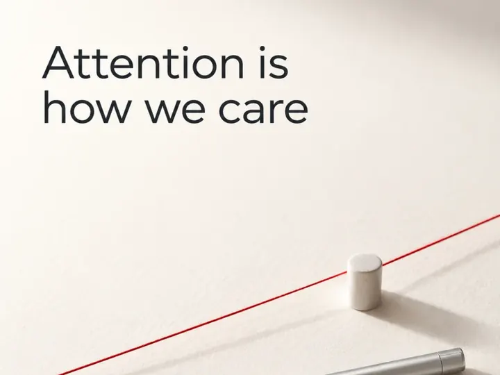Attention is how we care. A pen beside a single red line.